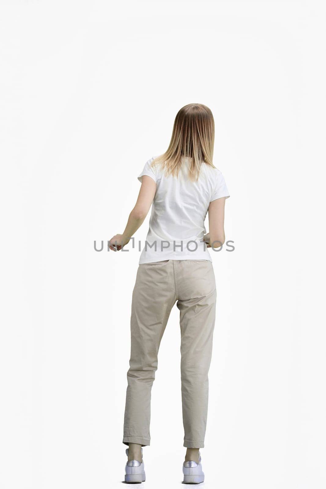 A woman, full-length, on a white background.