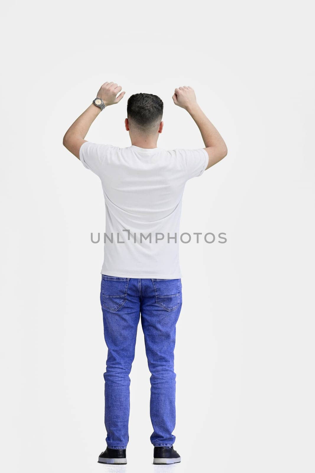 A man, full-length, on a white background, waving his arms.