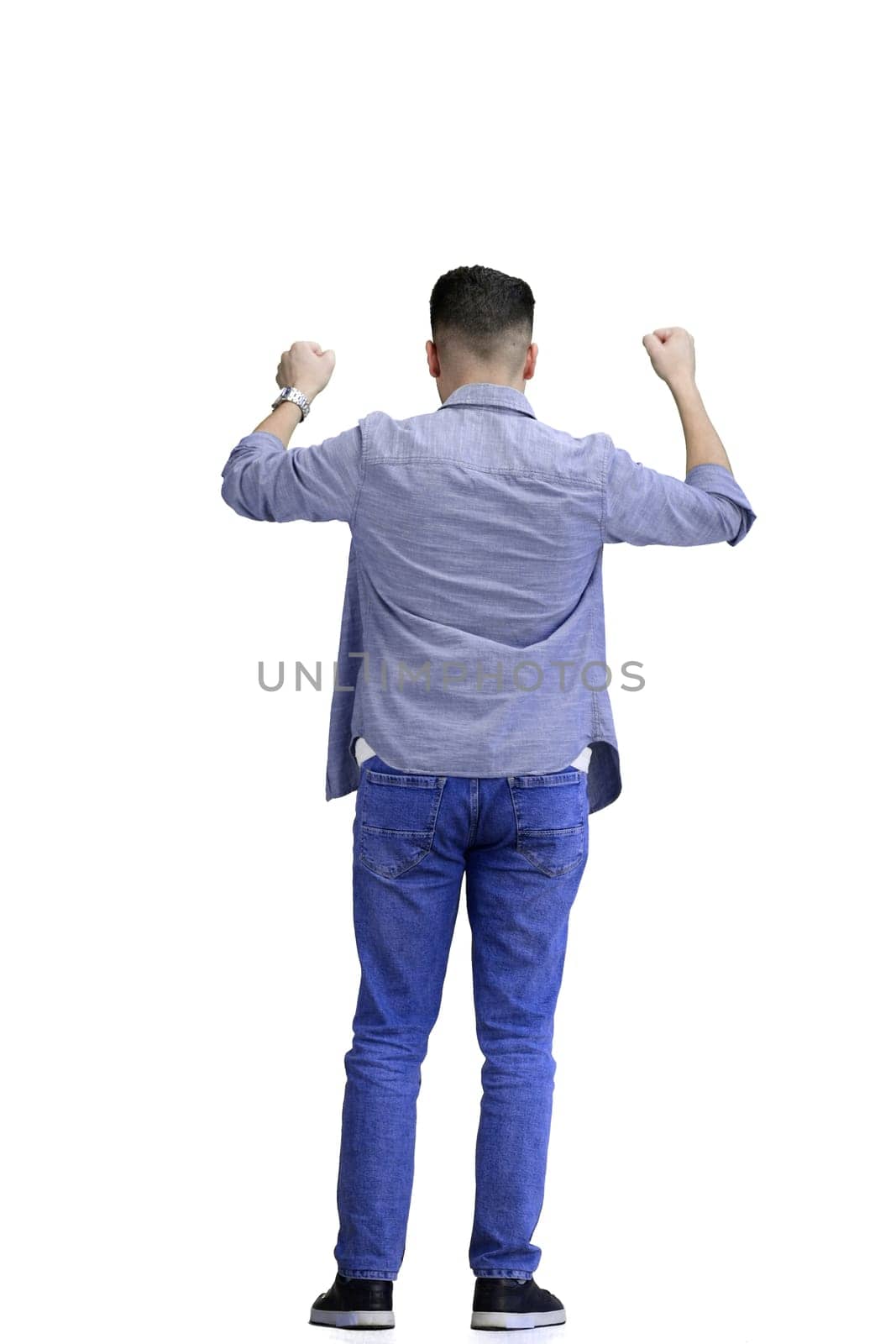 A man, full-length, on a white background, spreads his arms.