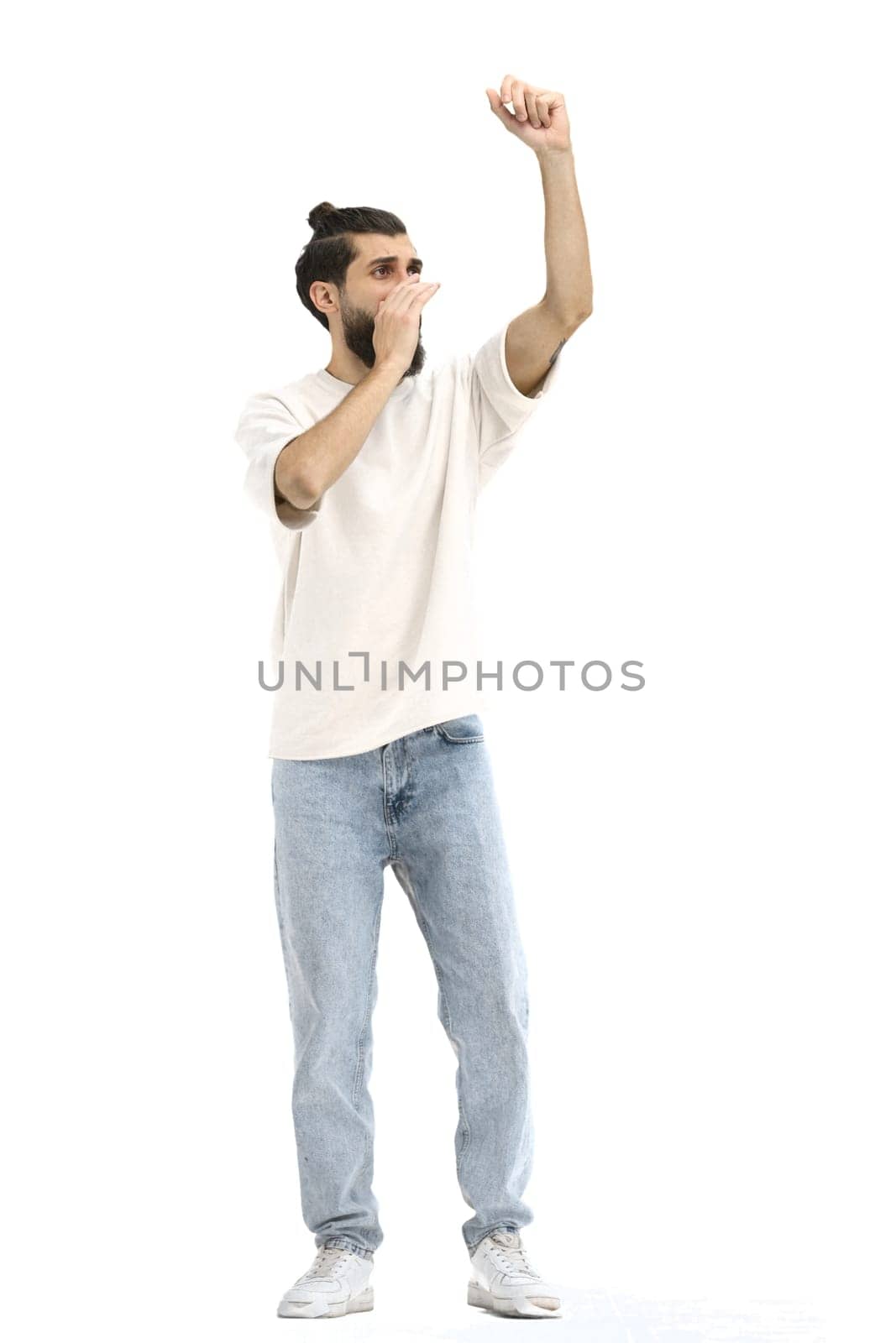 A man, full-length, on a white background, rejoices.