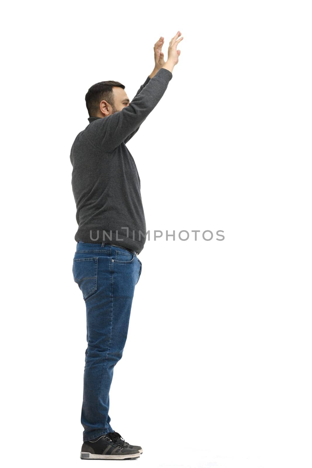 A man, full-length, on a white background, waving his arms.