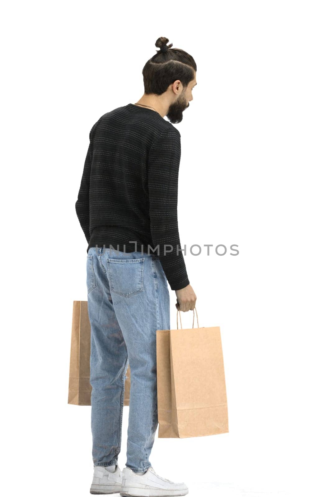 A man, full-length, on a white background, with bag.