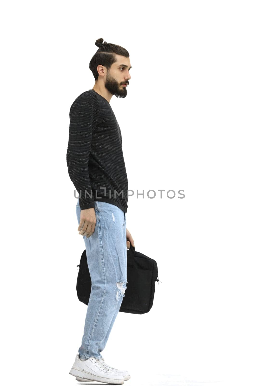 A man, full-length, on a white background, with a briefcase.