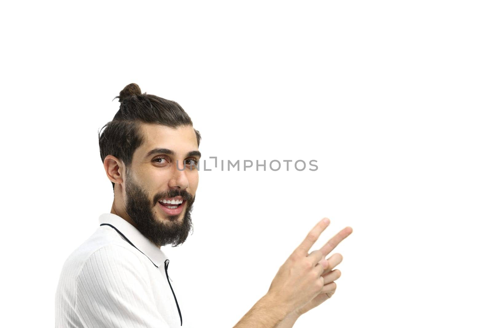 A man, close-up, on a white background, points to the side by Prosto