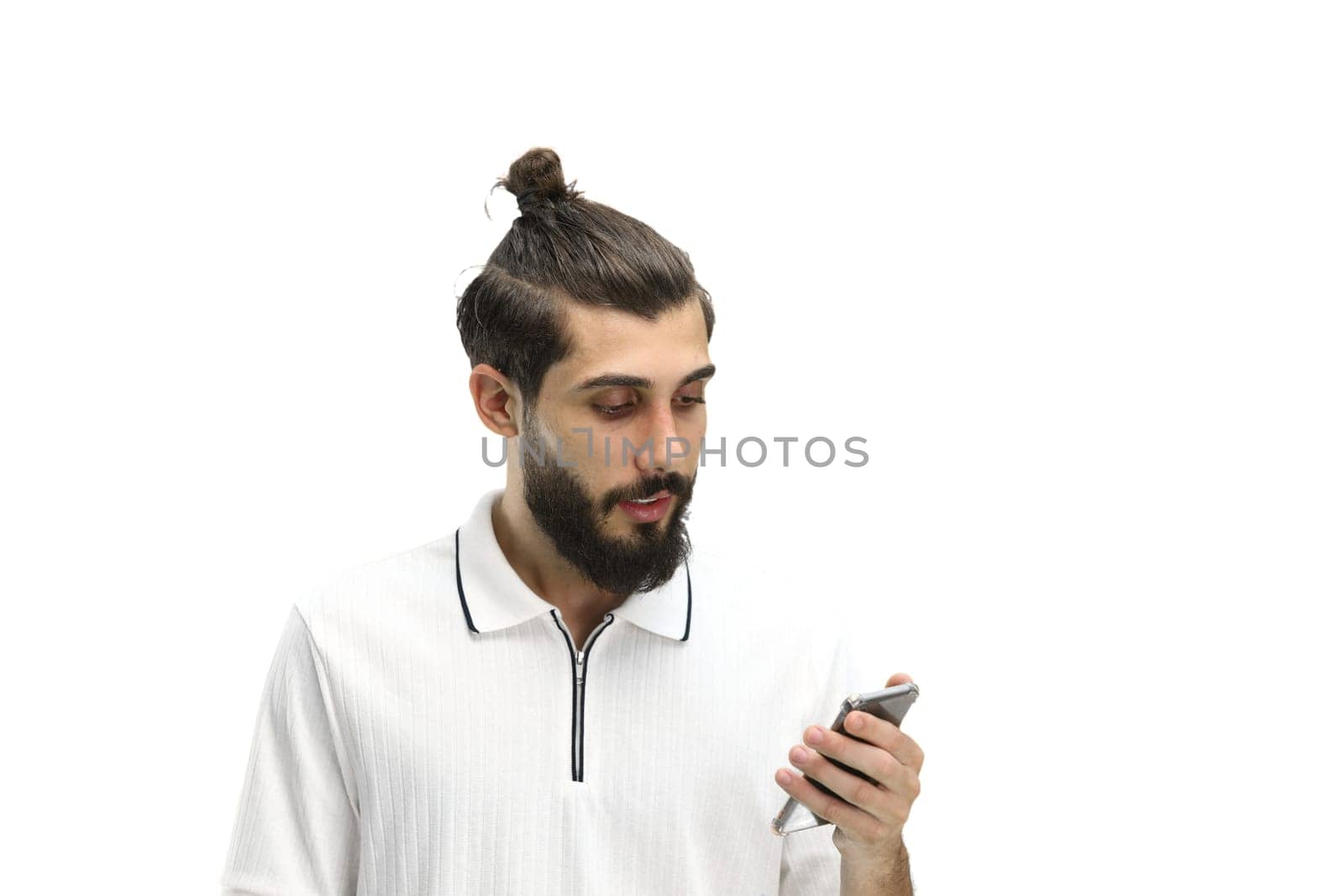 Man, close-up, on a white background, with a phone.