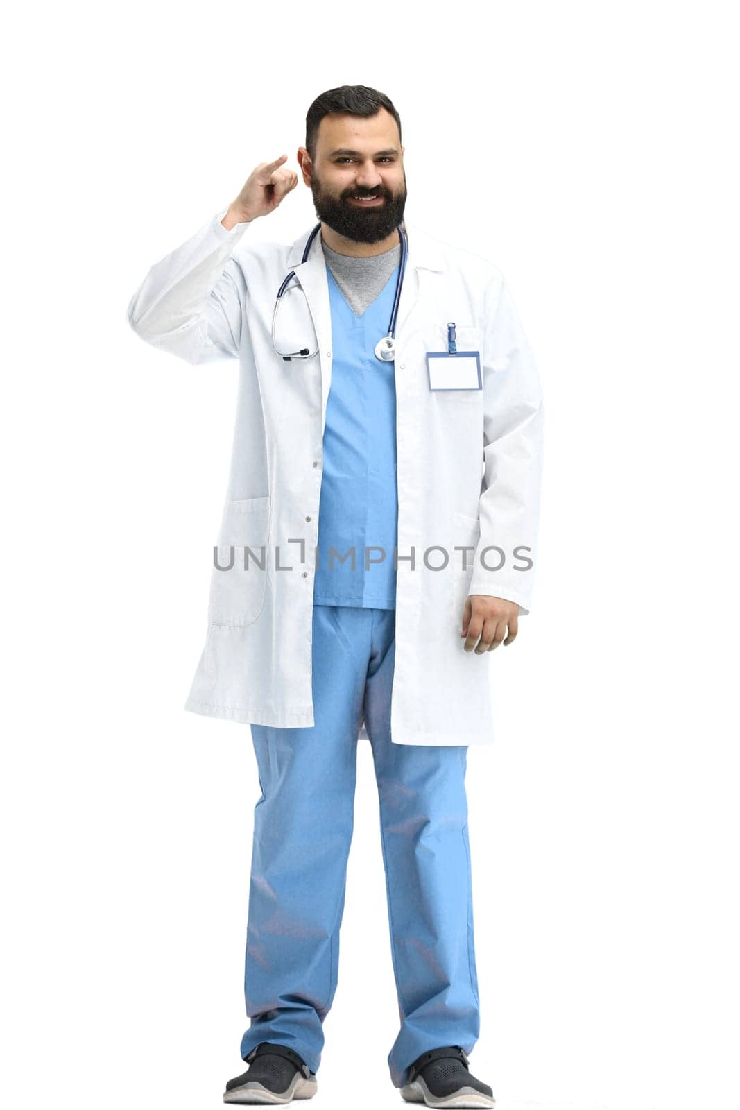 Male doctor, full-length, on a white background, show call sign.