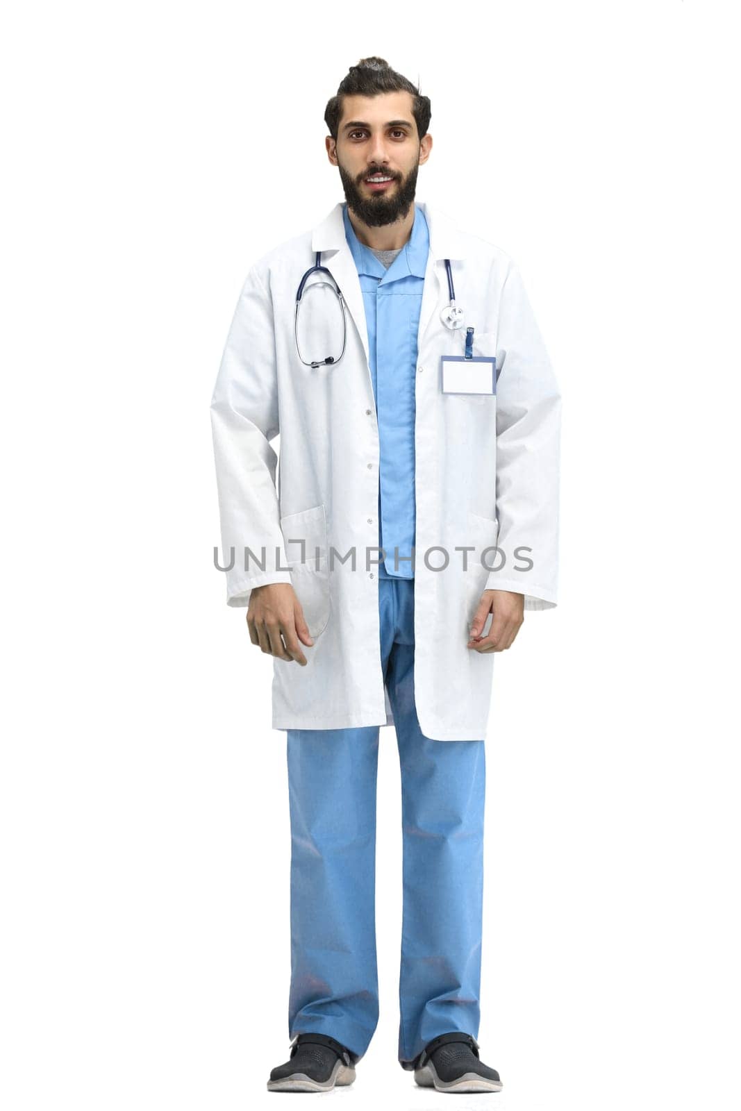 Male doctor, full-length, on a white background.