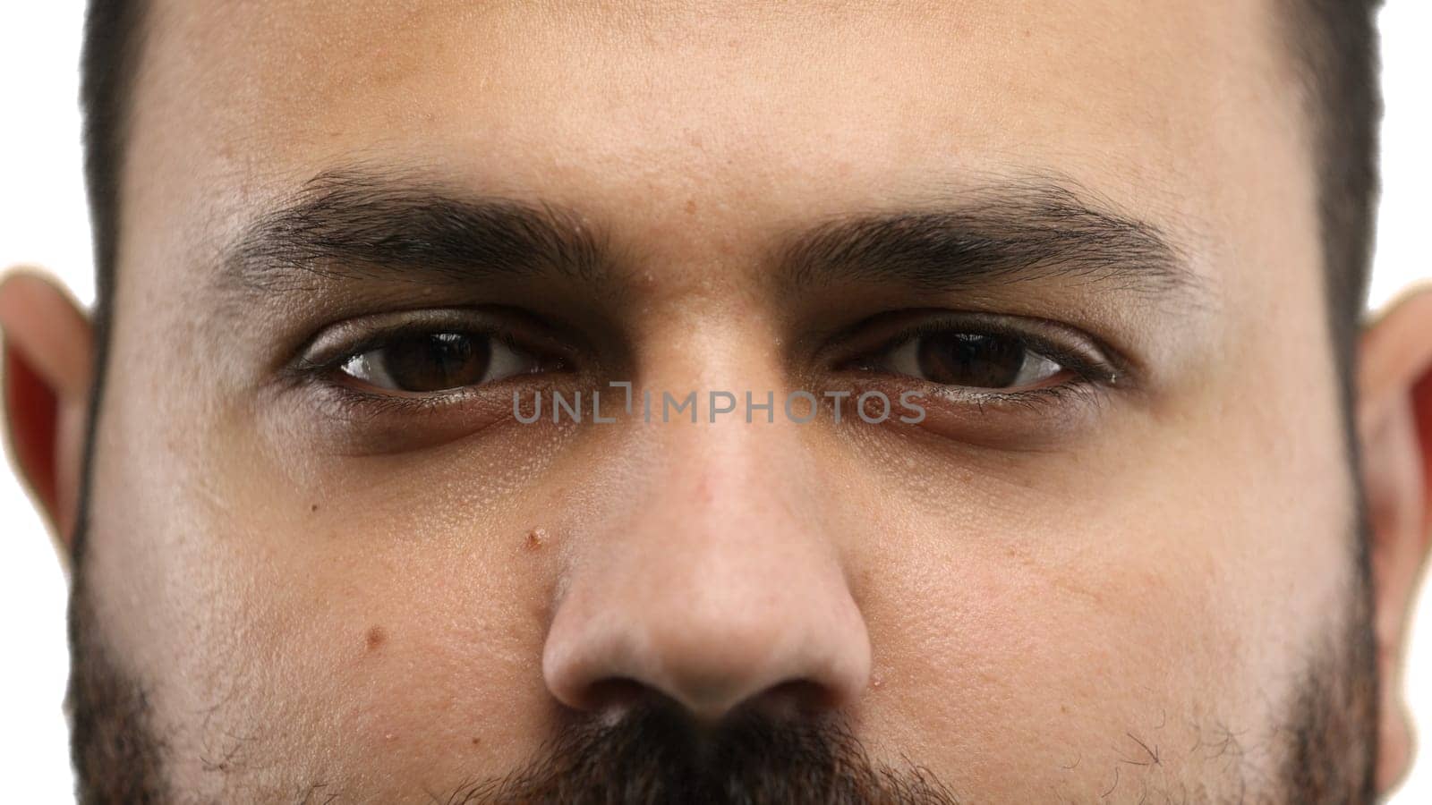 Man's eyes, close-up, on a white background.