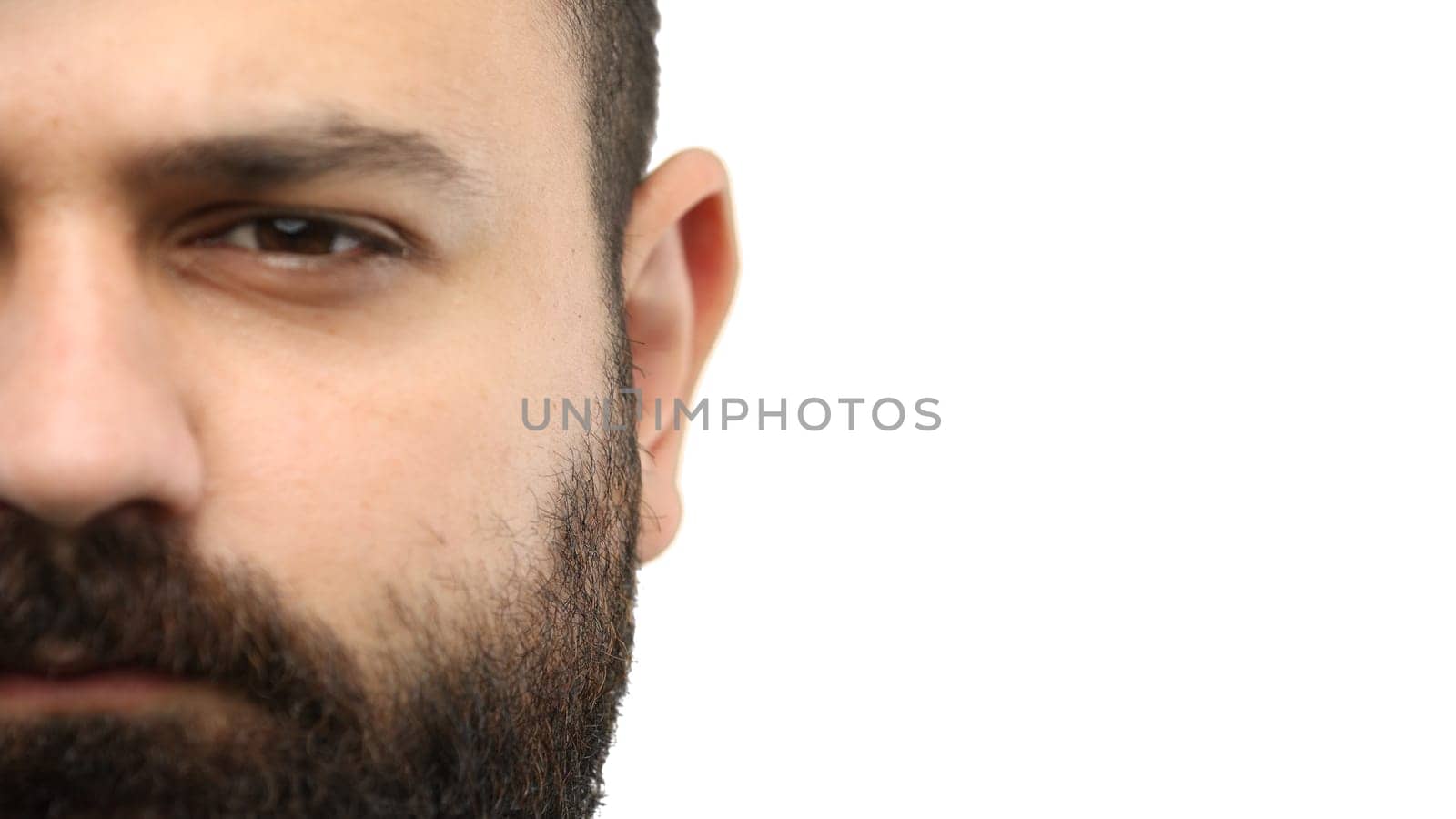 Man's face, close-up, on a white background.