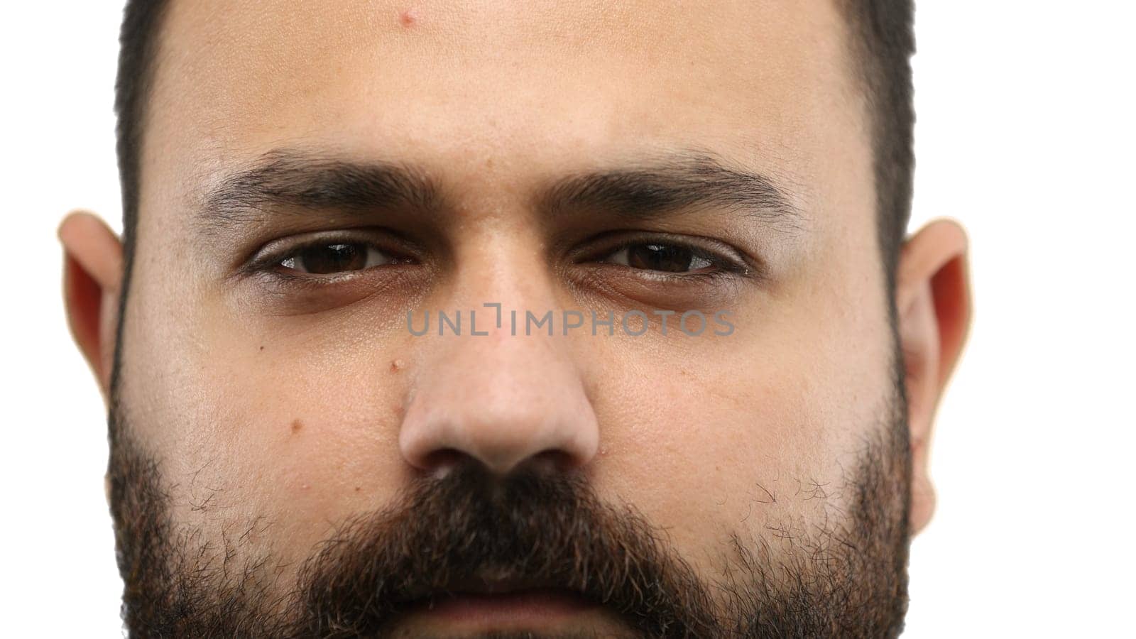 Man's face, close-up, on a white background.