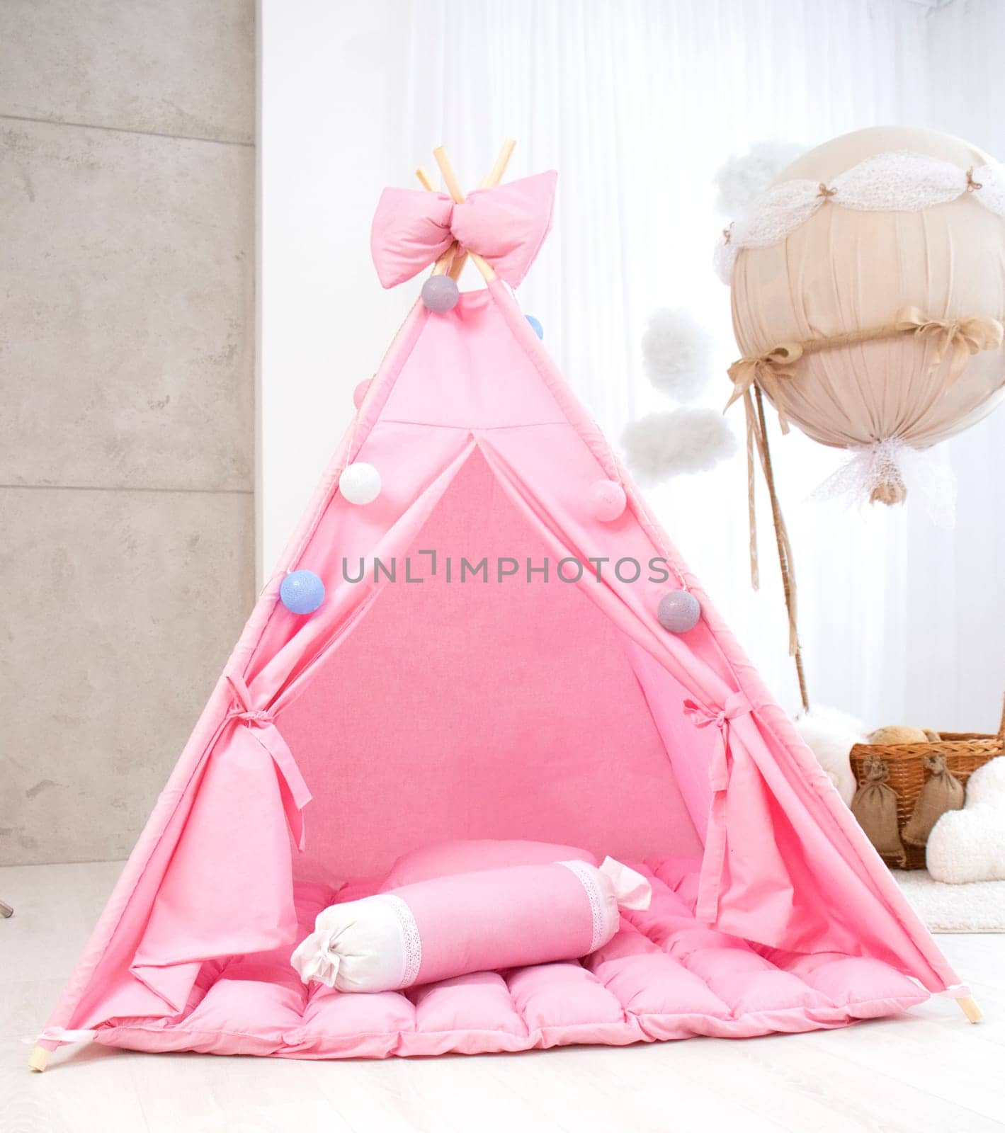 Playroom with Teepee. Modern room interior with play tent for child. pink wigwam by Suietska