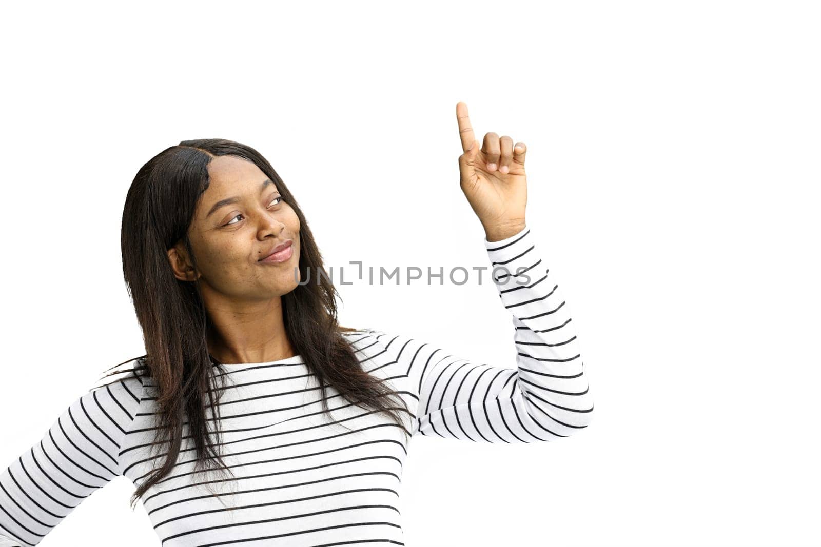 Woman, on a white background, close-up, pointing up.