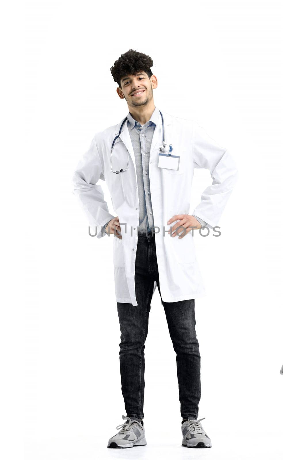 Male doctor, full-length, on a white background, hands on hips by Prosto