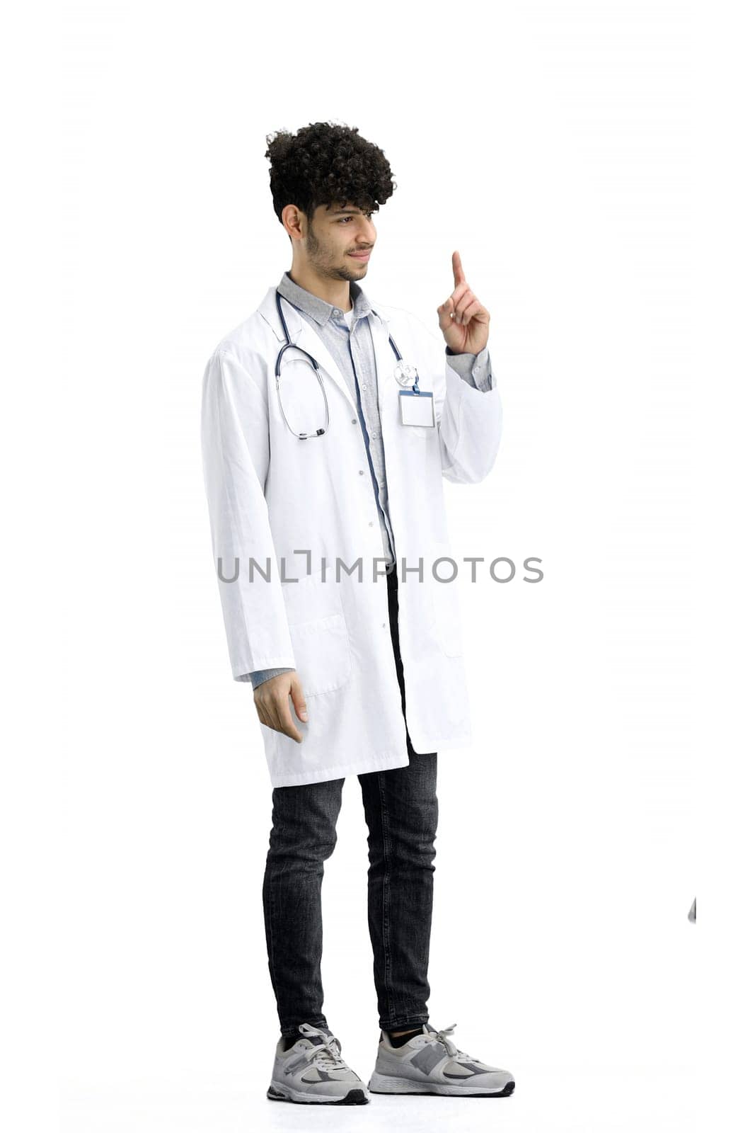 A male doctor, full-length, on a white background, shows an important sign by Prosto