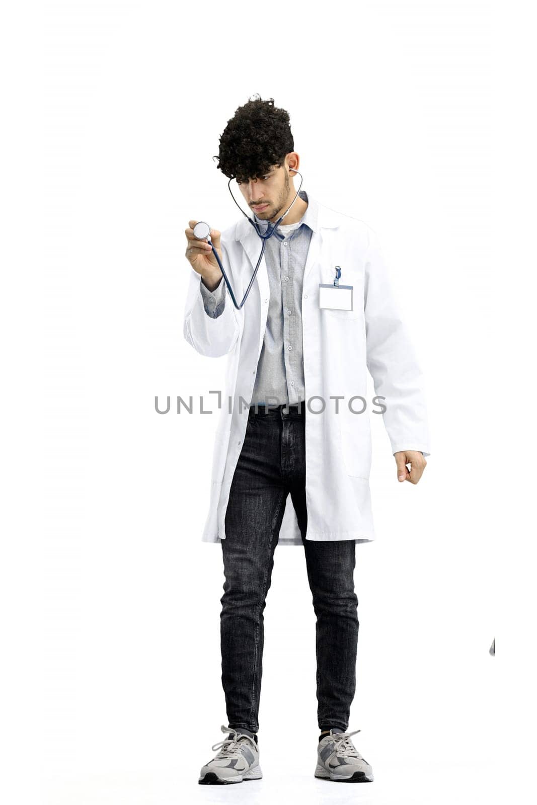 Male doctor, full-length, on a white background, with a stethoscope.
