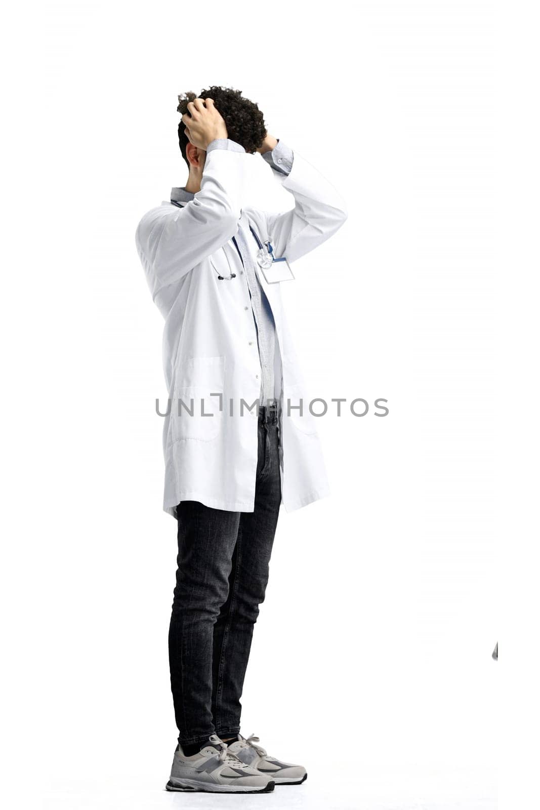 Male doctor, on a white background, full-length, tired.