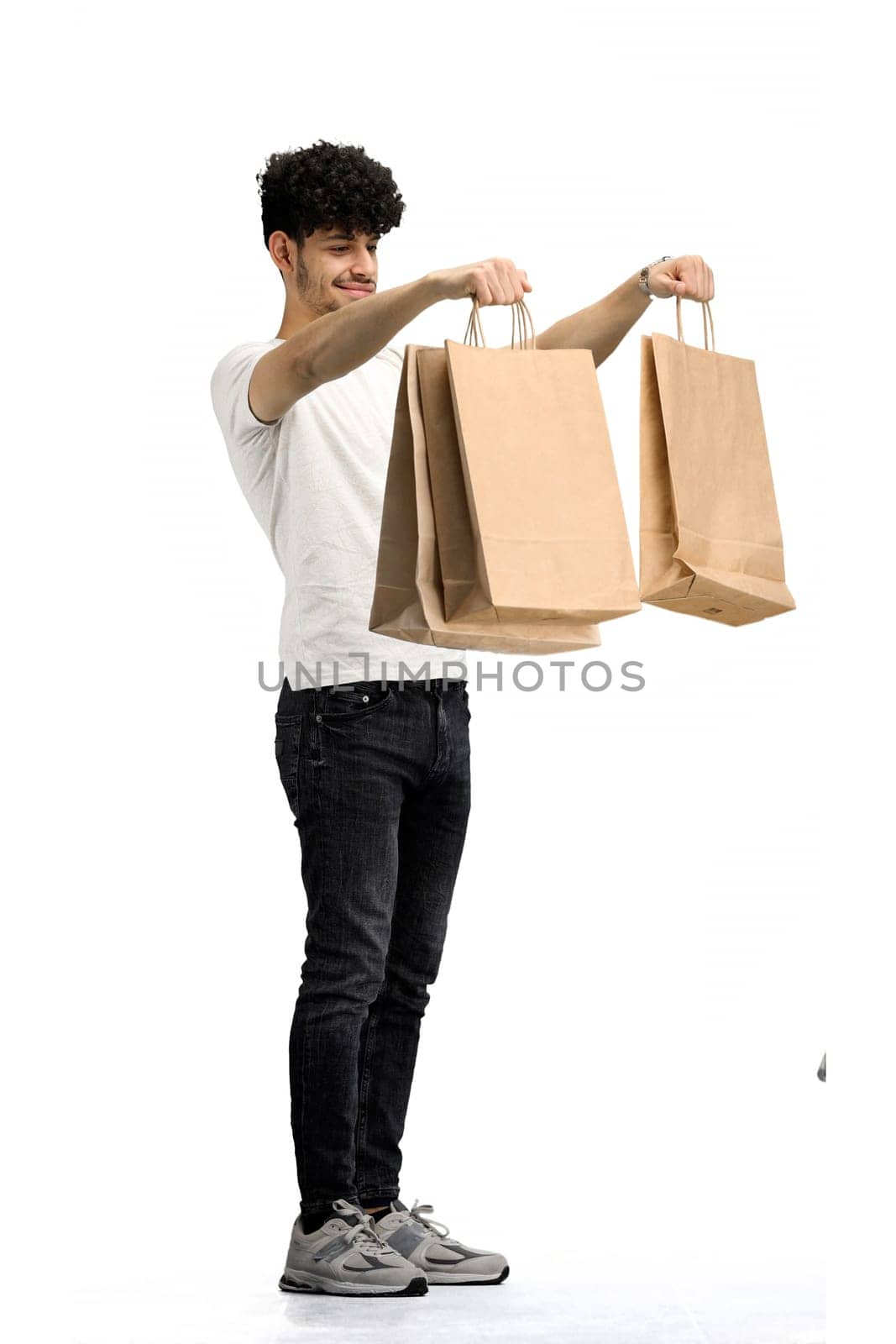 Man, on a white background, full-length, with bags by Prosto