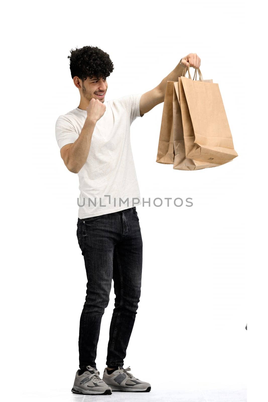 Man, on a white background, full-length, with bags by Prosto