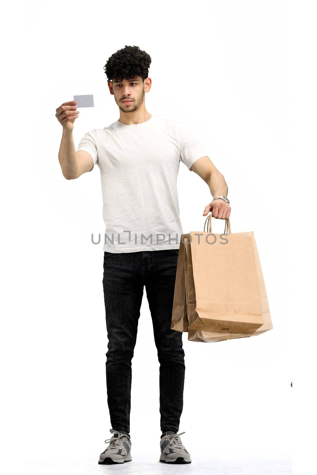Man, on a white background, full-length, with bags and card by Prosto