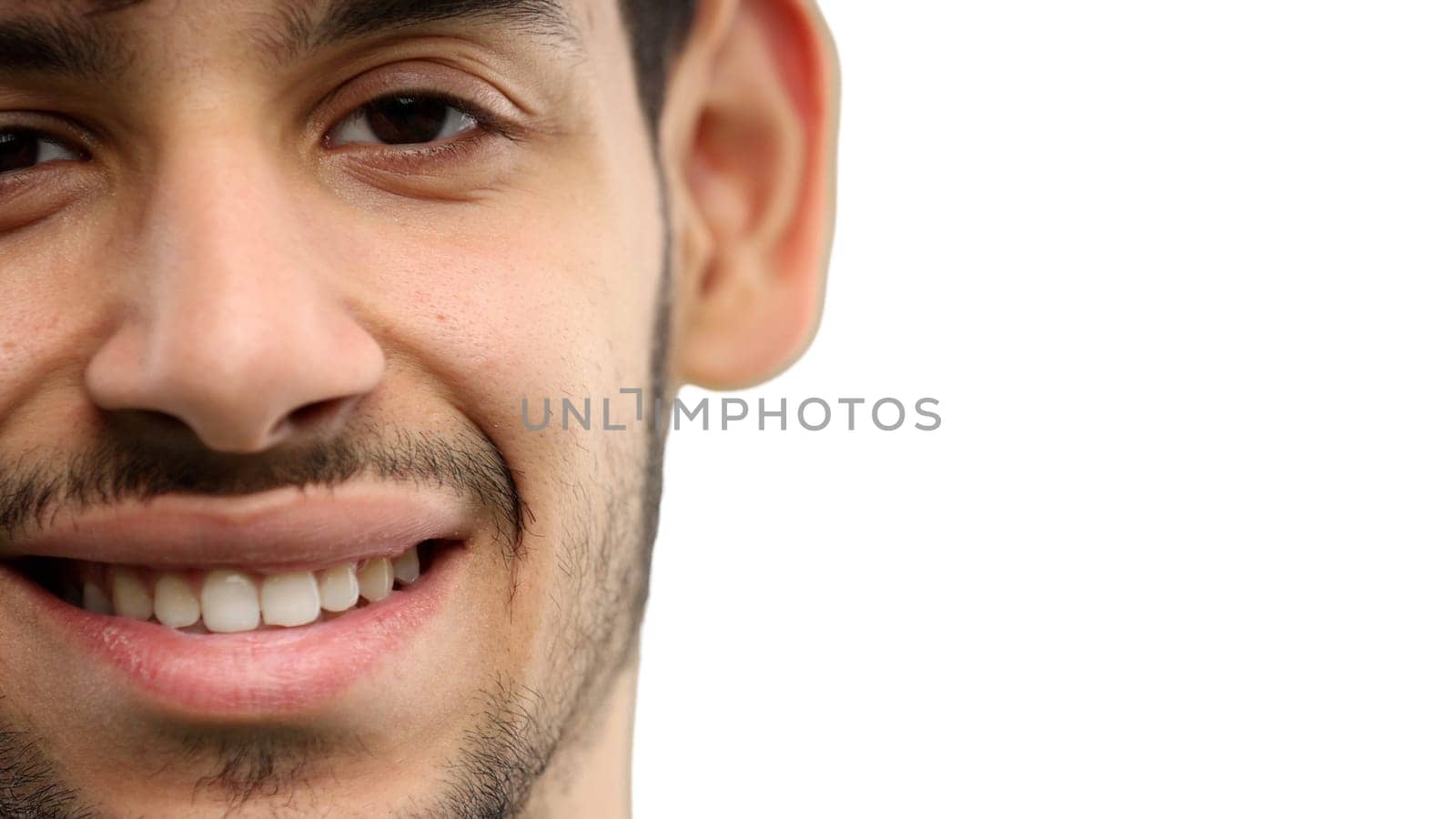 Man's face, on a white background, close-up.