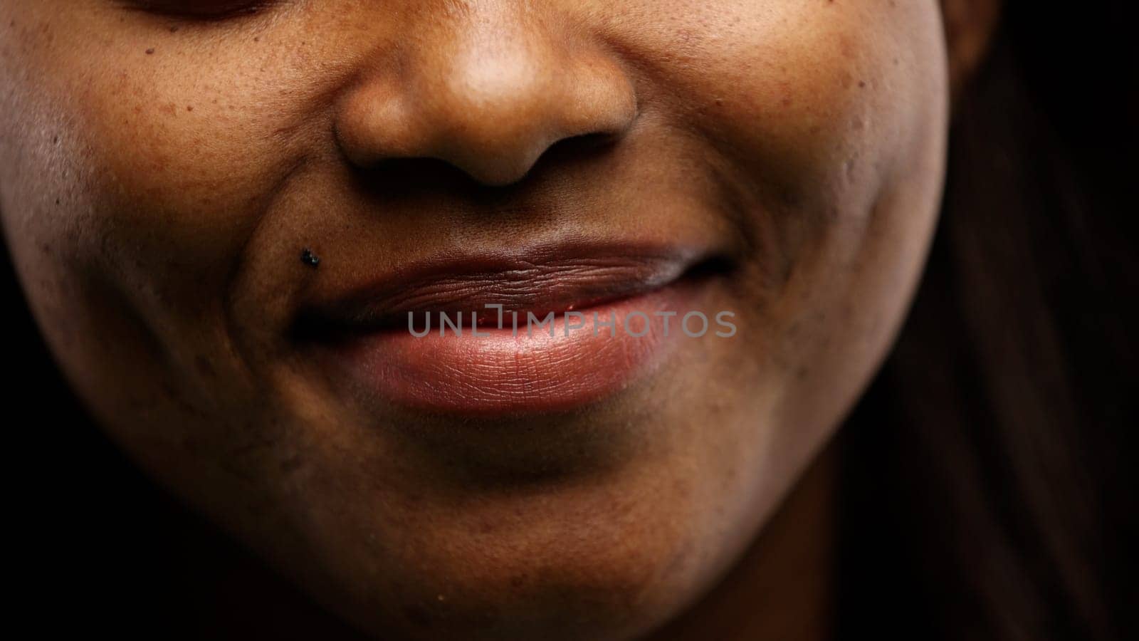 Woman's mouth, mouth closed, close-up.