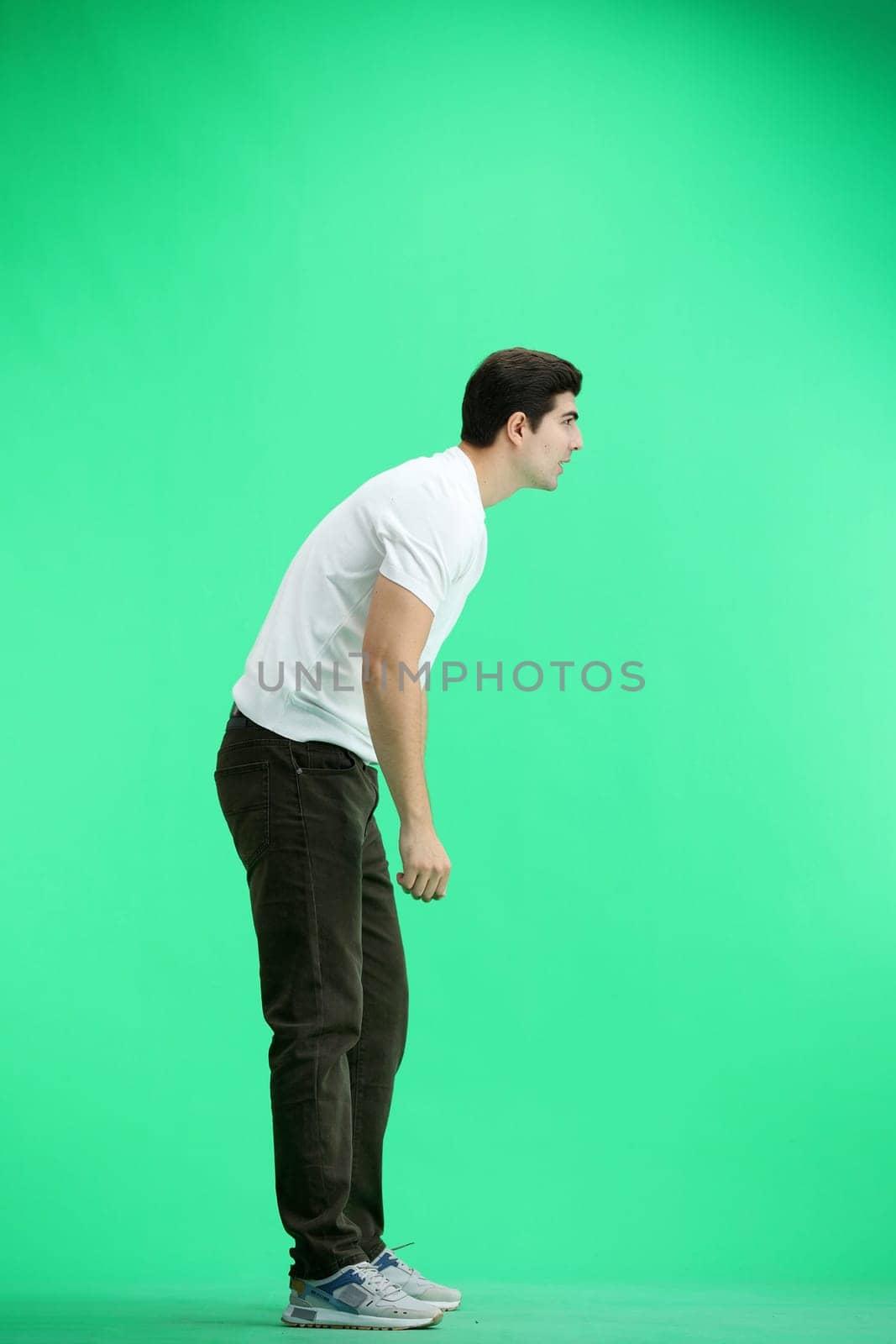 A man in full height, on a green background by Prosto