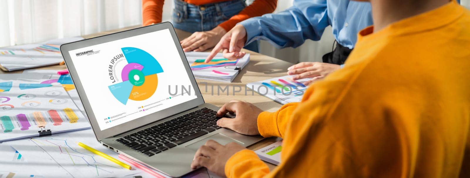 Startup company employee working together using laptop analyzing BI dashboard paper on financial data report and planning strategic marketing for business success in panorama banner. Synergic