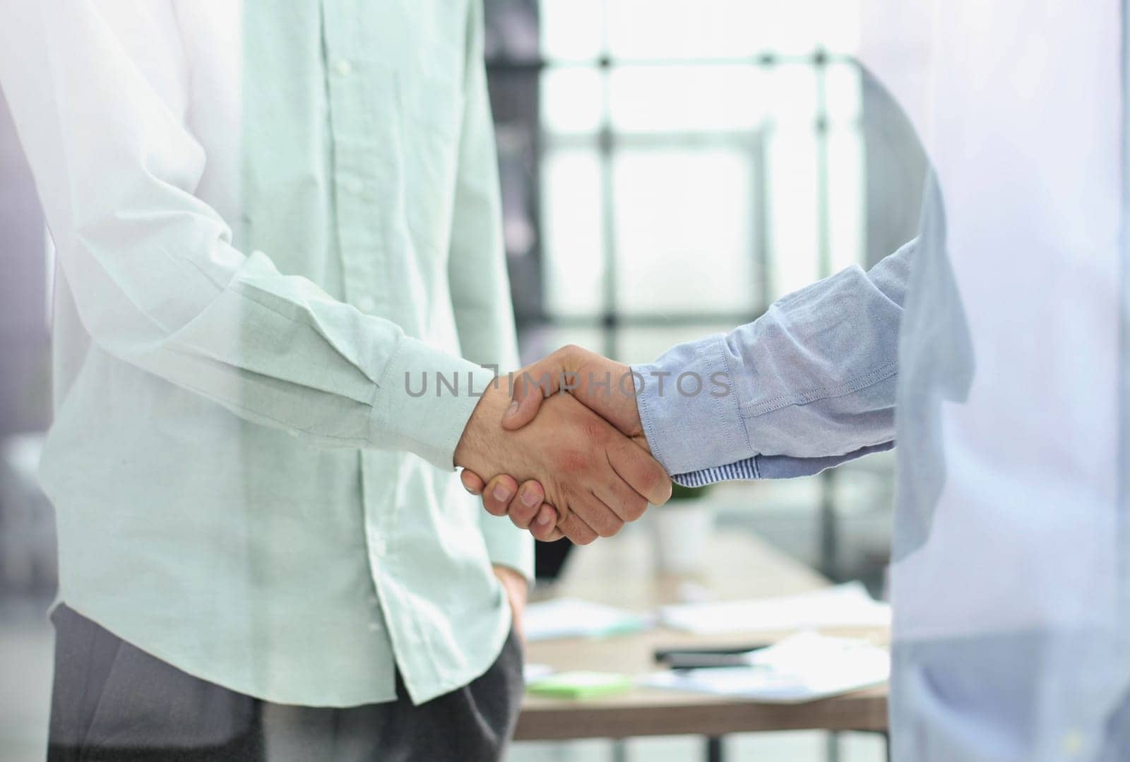 Close up of handshake in the office