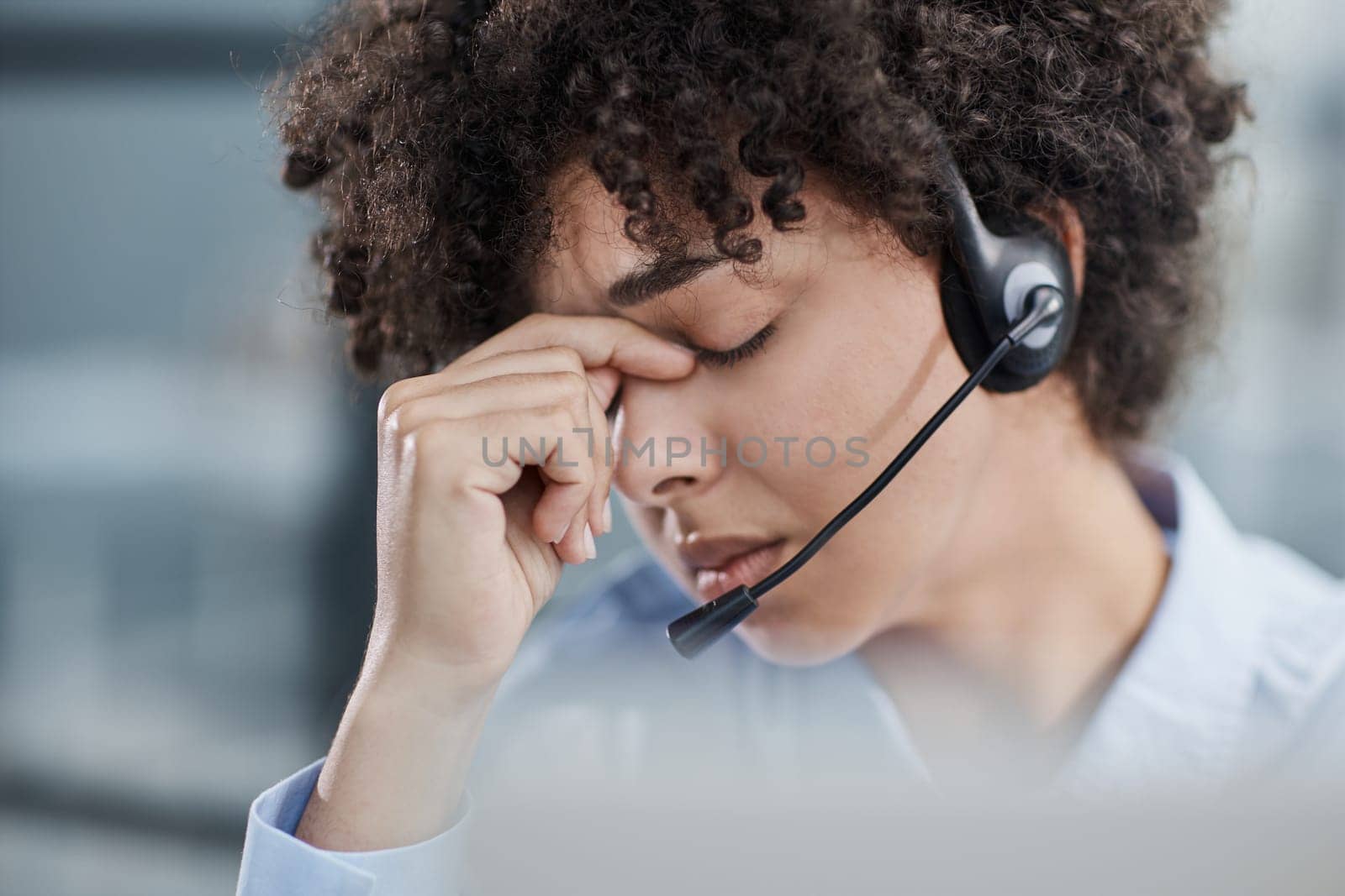 a girl in a modern office working in a call center concentrates on explaining the procedure by Prosto