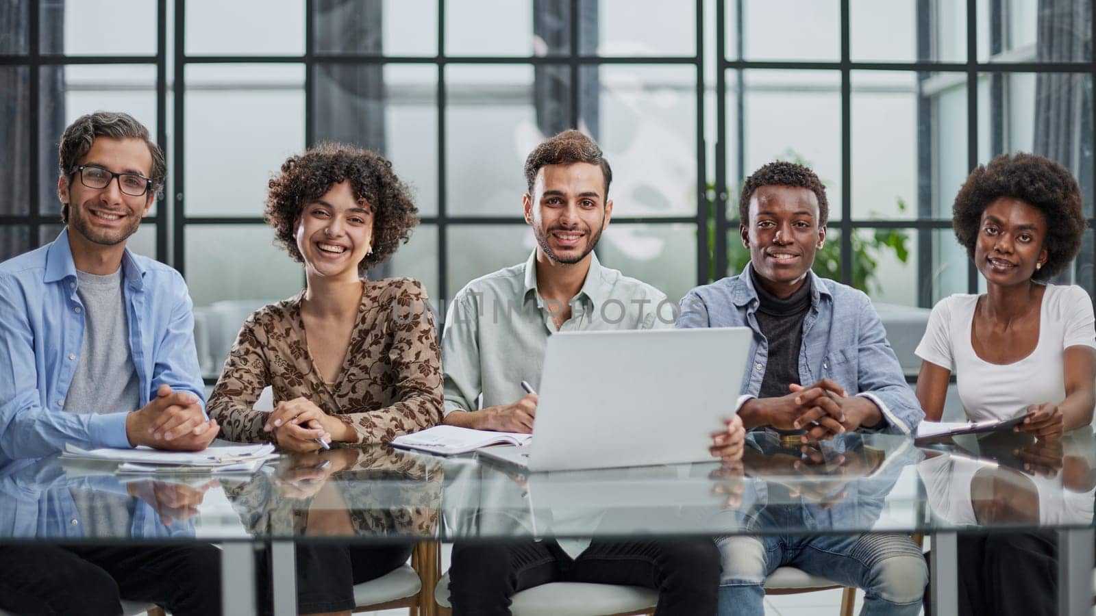 group of young businessmen in the office by Prosto