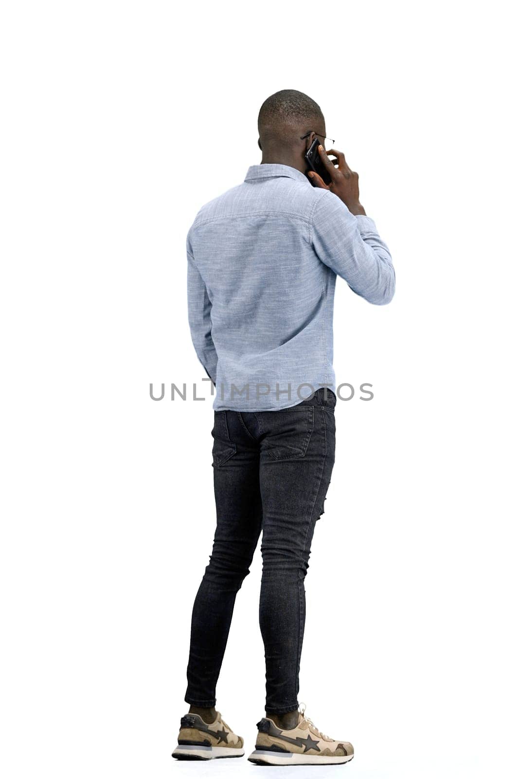 A man, full-length, on a white background, talking on the phone by Prosto