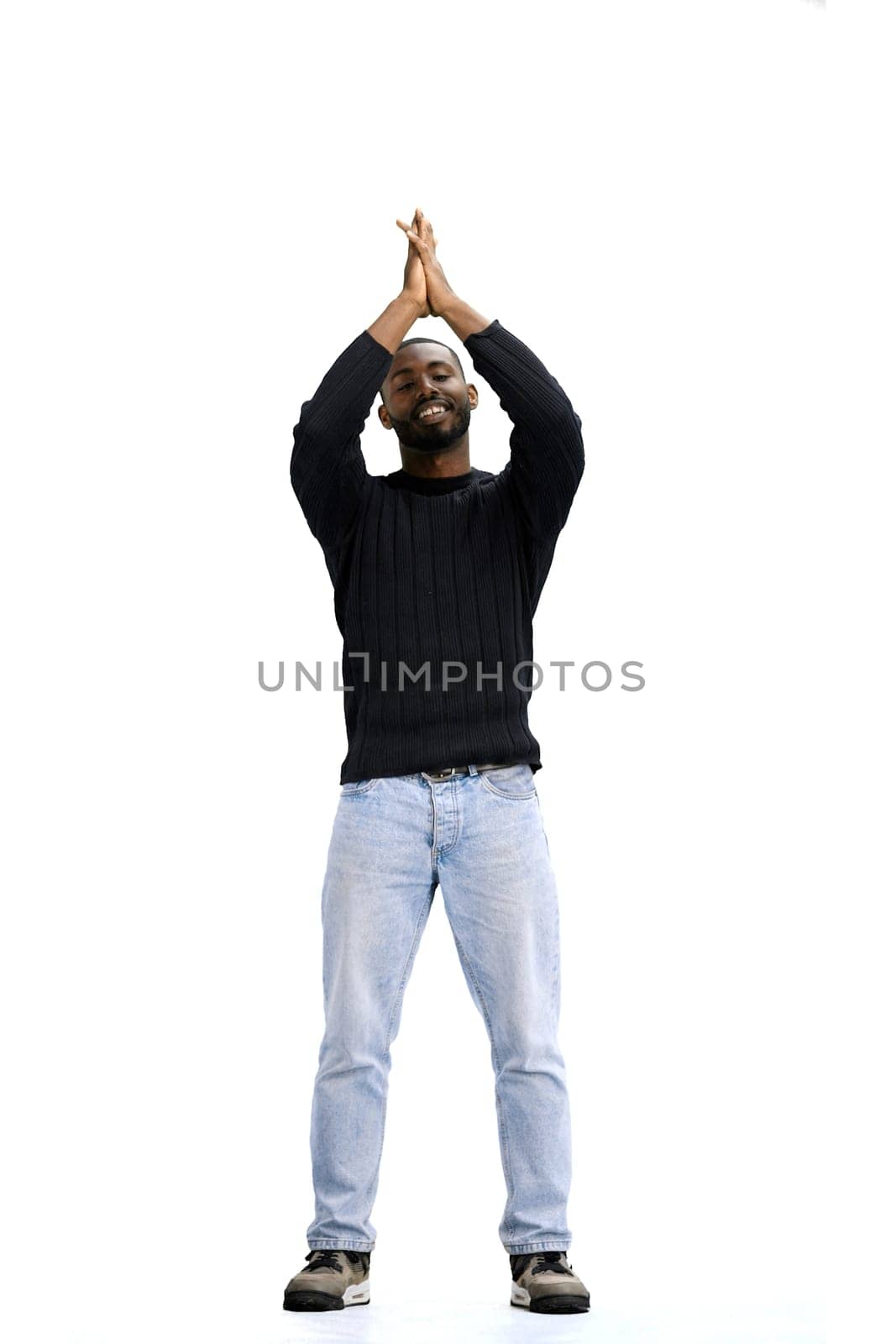 A man, full-length, on a white background, claps.