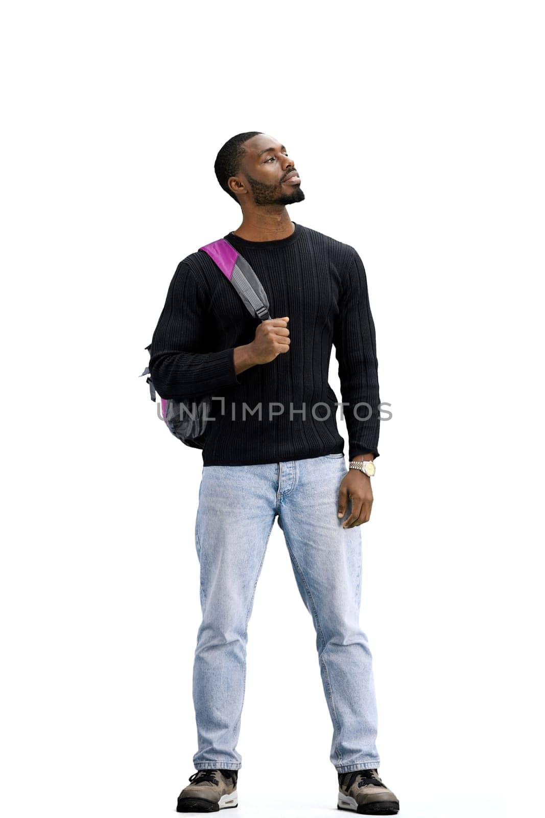 A man, full-length, on a white background, with a backpack.