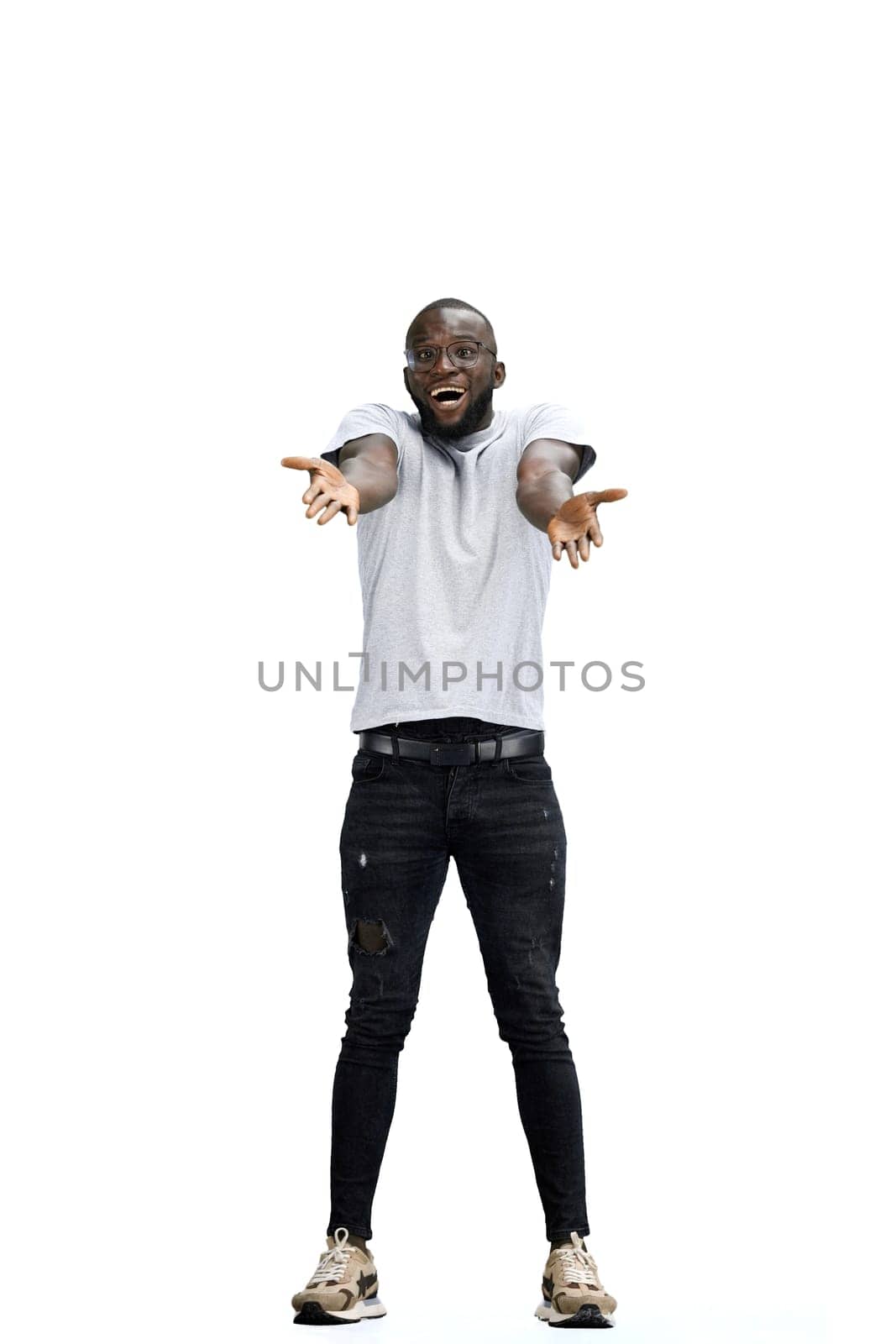 A man, full-length, on a white background, spreads his arms by Prosto