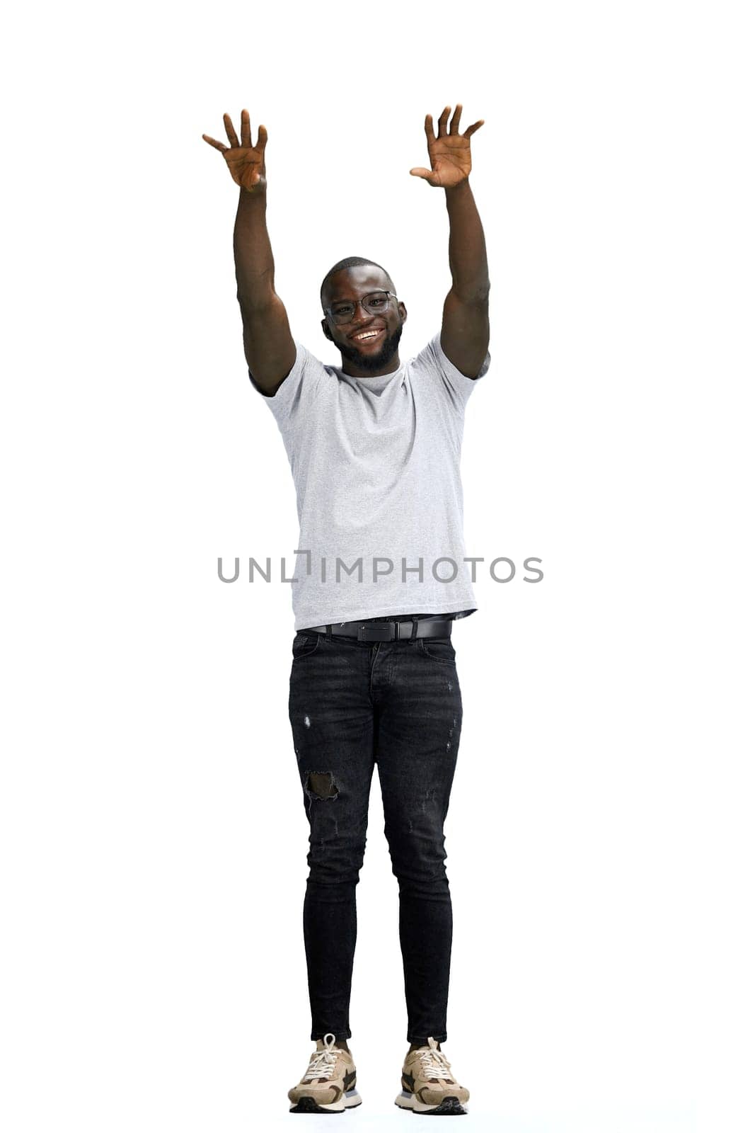 A man, full-length, on a white background, waving his arms.