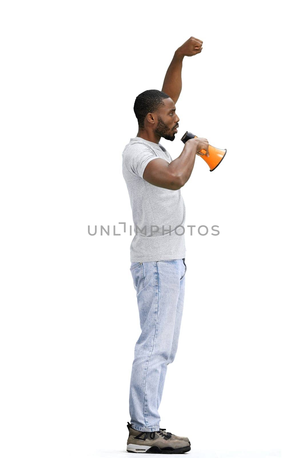 A man, full-length, on a white background, with a megaphone.