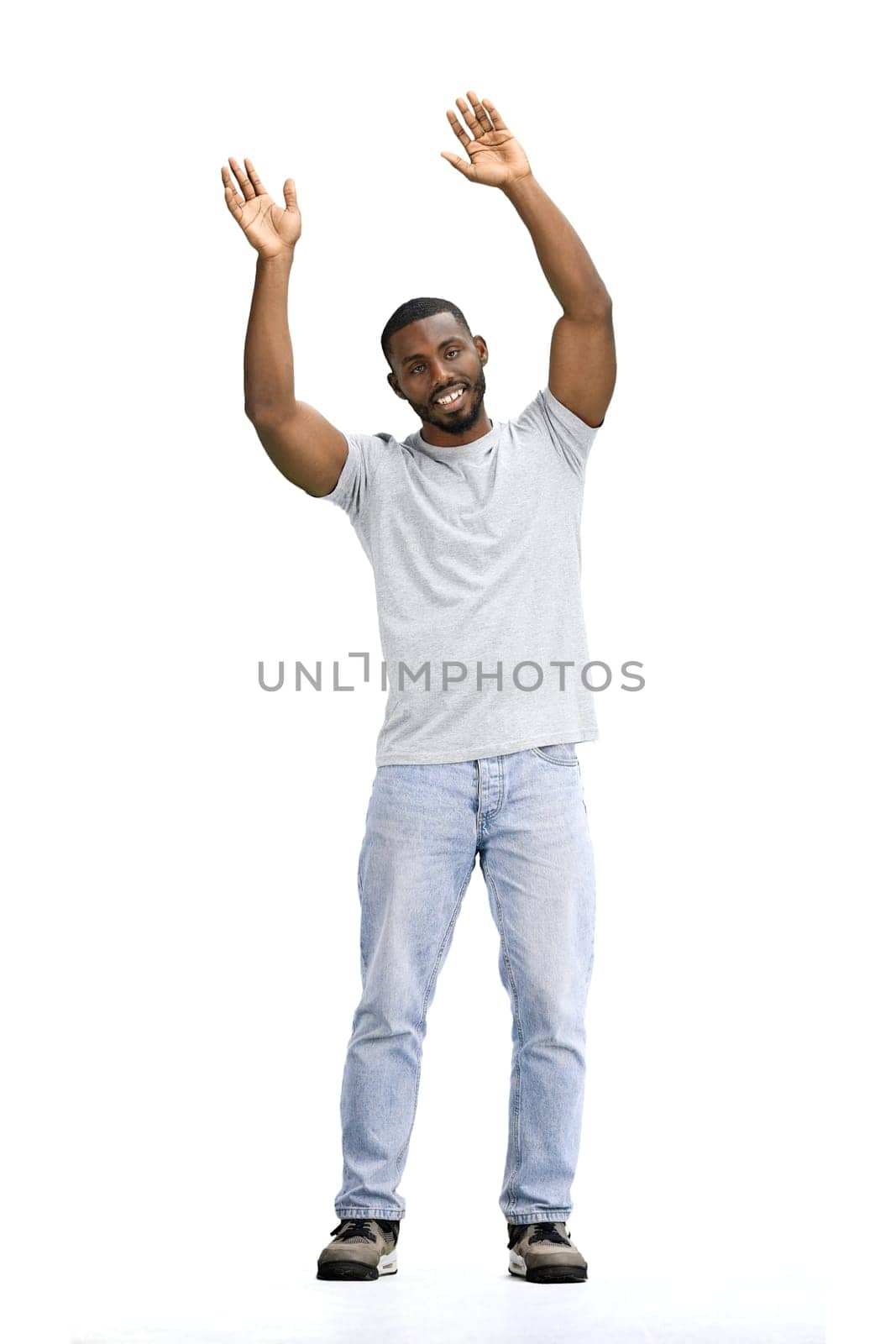 A man, full-length, on a white background, waving his arms.