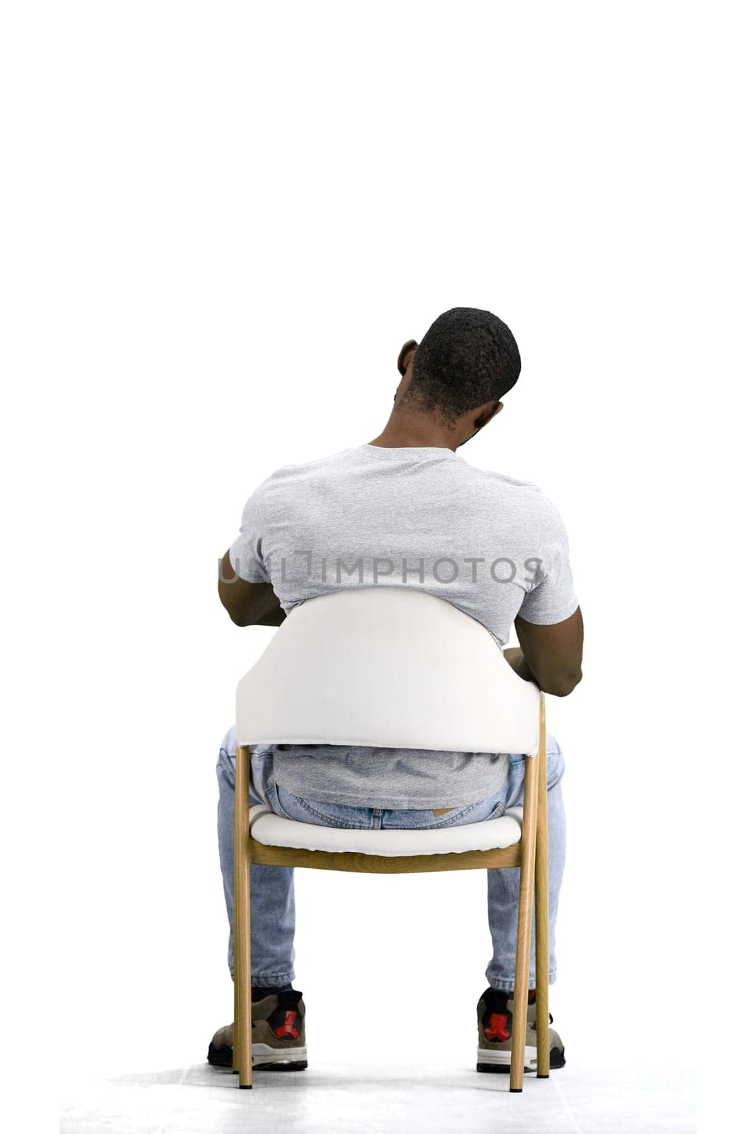 A man, on a white background, sitting on a chair by Prosto