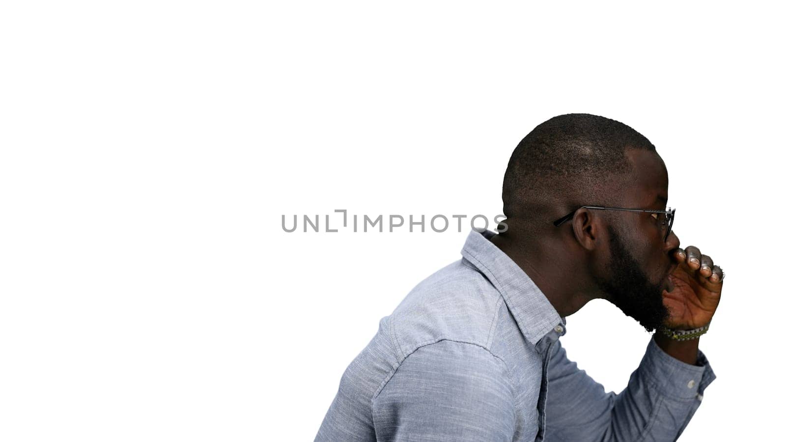 A man, close-up, on a white background, tells a secret by Prosto