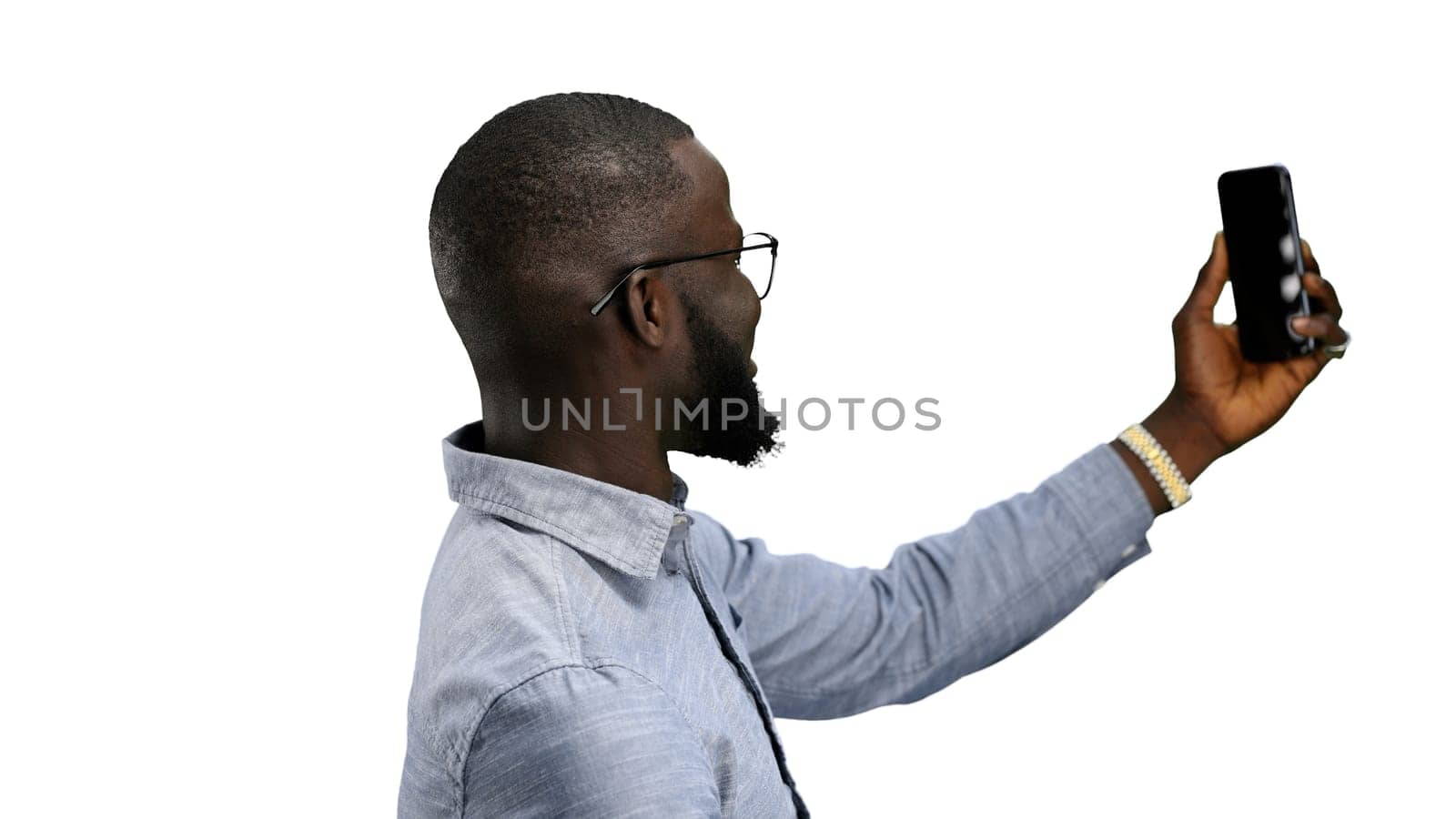 Man, close-up, on a white background, talking on the phone by Prosto