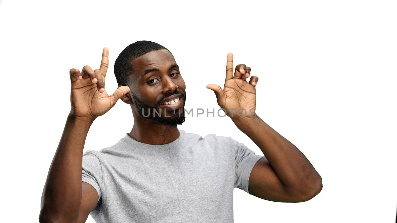 Man, close-up, on a white background, pointing up by Prosto