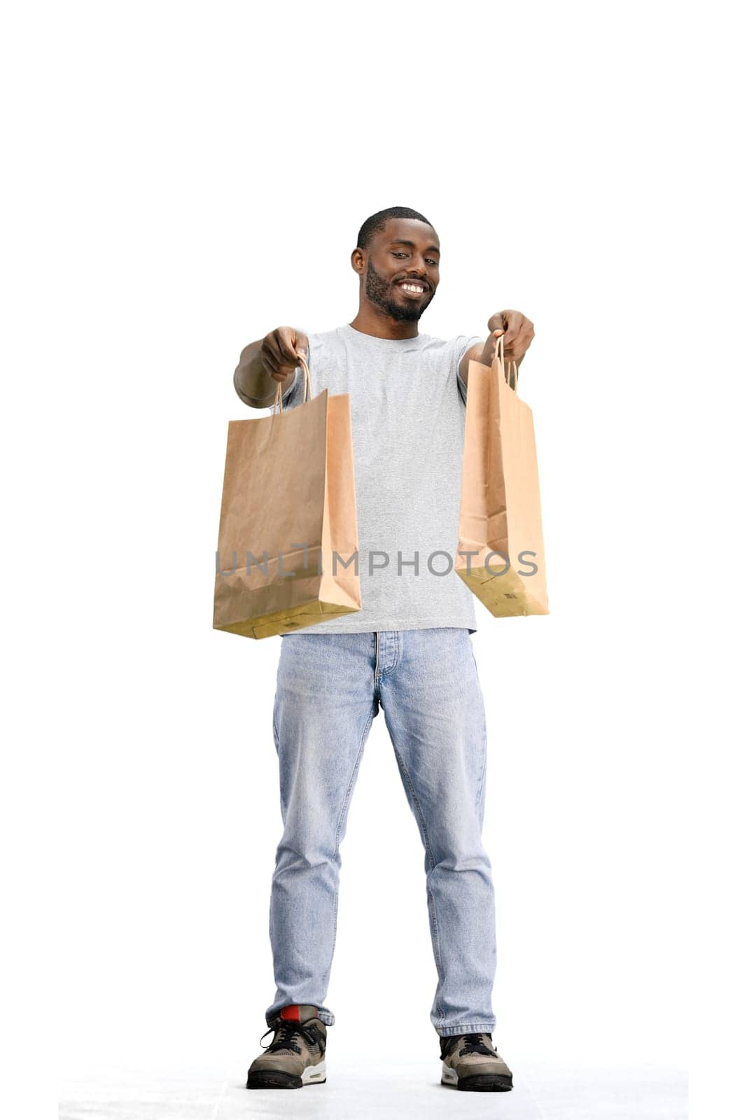 A man, full-length, on a white background, with bags by Prosto