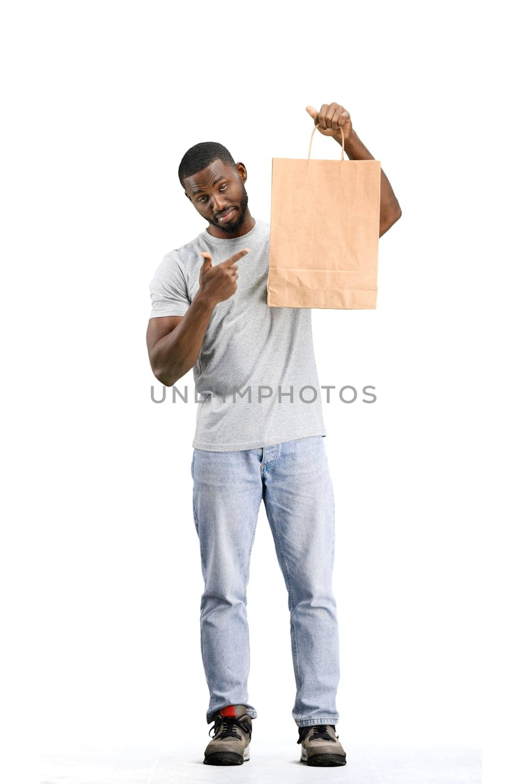 A man, full-length, on a white background, with bags by Prosto