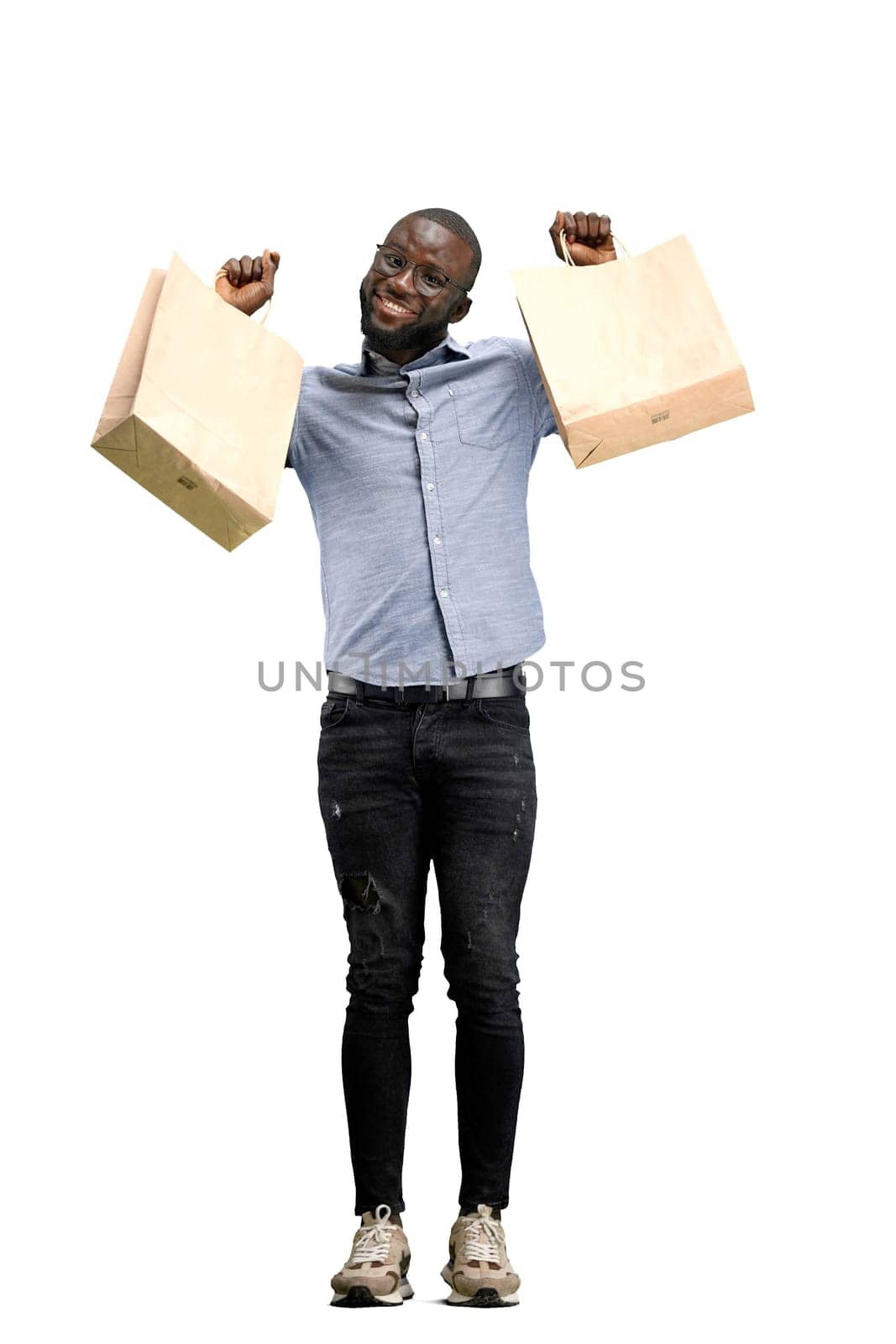 A man, full-length, on a white background, with bags.
