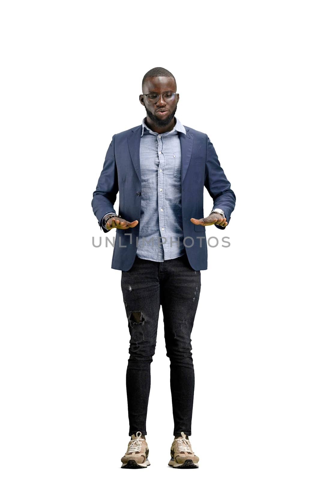 A man, full-length, on a white background, meditating.