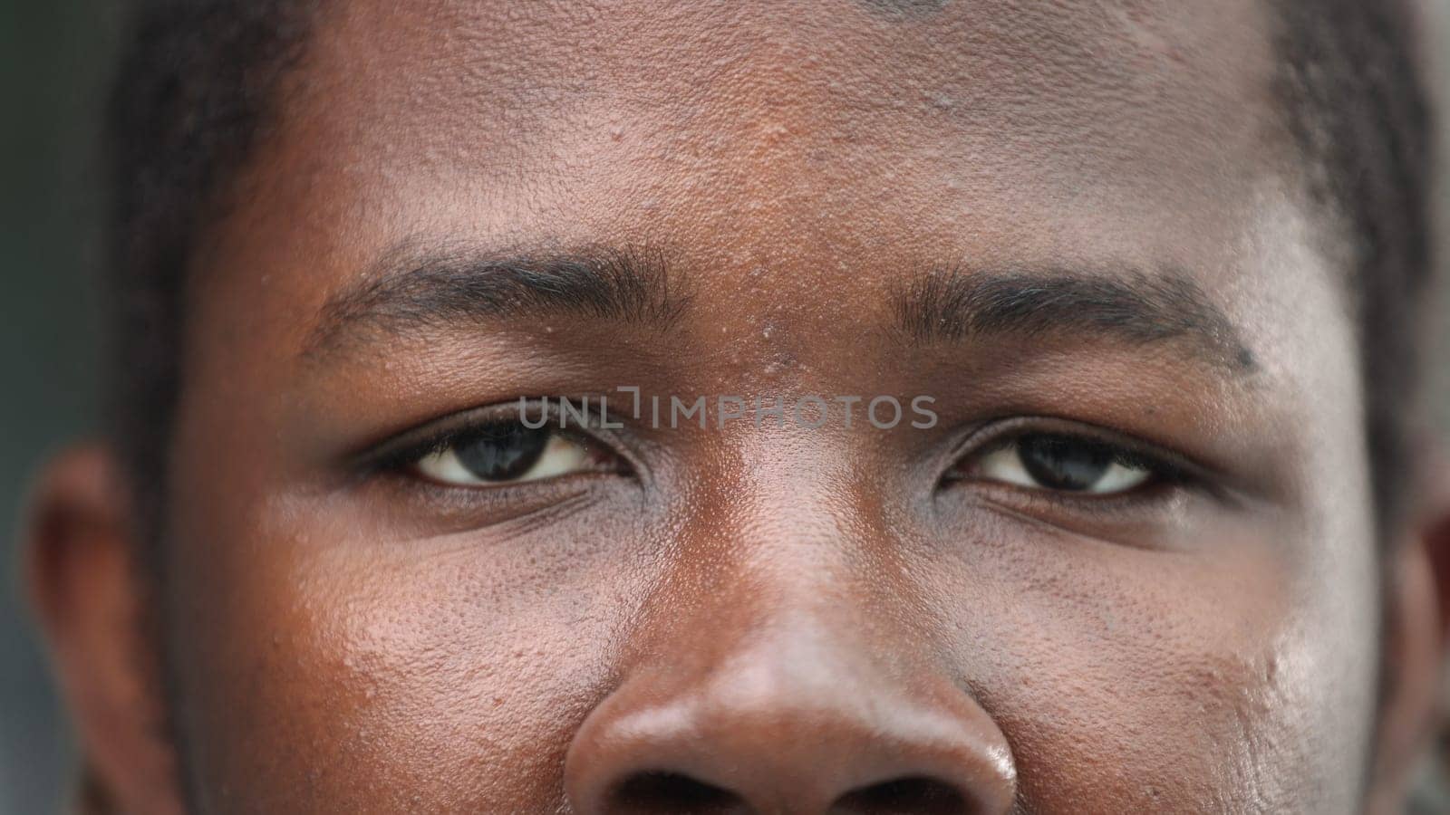 close-up of the face of a smiling African American man by Prosto