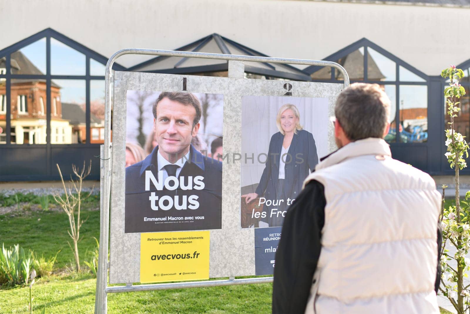 PARIS, FRANCE - APRIL 20, 2022 : The banners with candidates for President elections 2022 by Godi