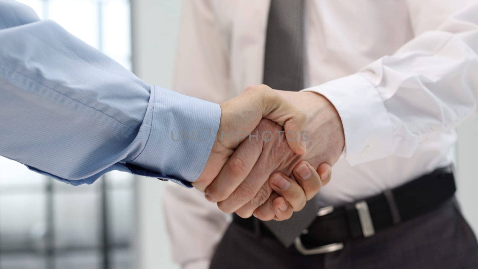 Handshake and congratulations after the transaction.