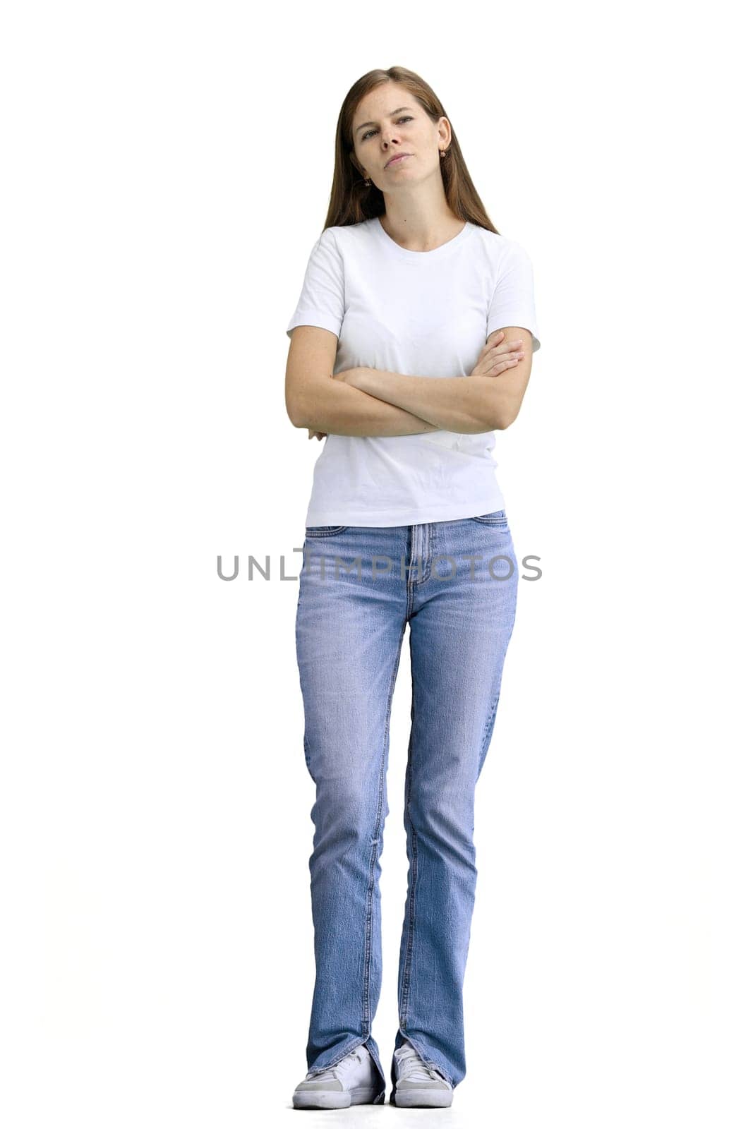 A woman, full-length, on a white background, crossed her arms.