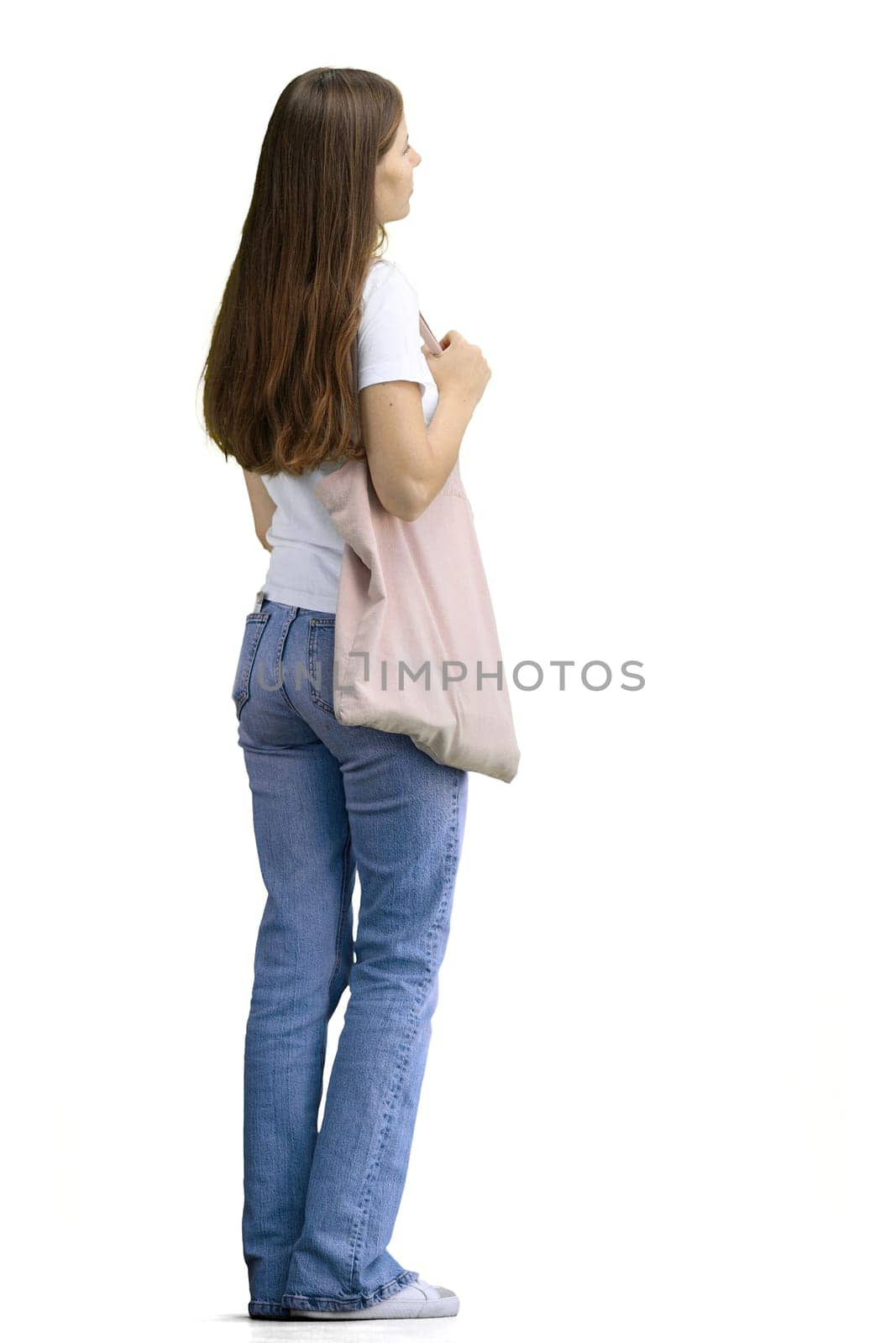 A woman, full-length, on a white background, with a bag.